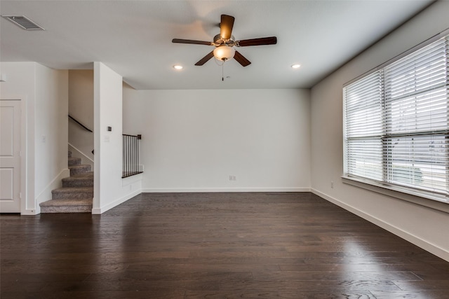 empty room featuring dark hardwood / wood-style floors and ceiling fan