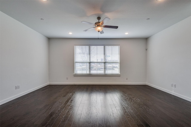 unfurnished room with dark wood-type flooring and ceiling fan