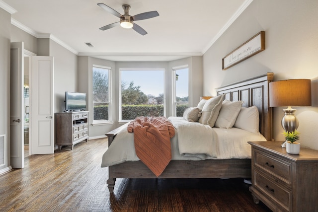 bedroom featuring ceiling fan, crown molding, and hardwood / wood-style floors