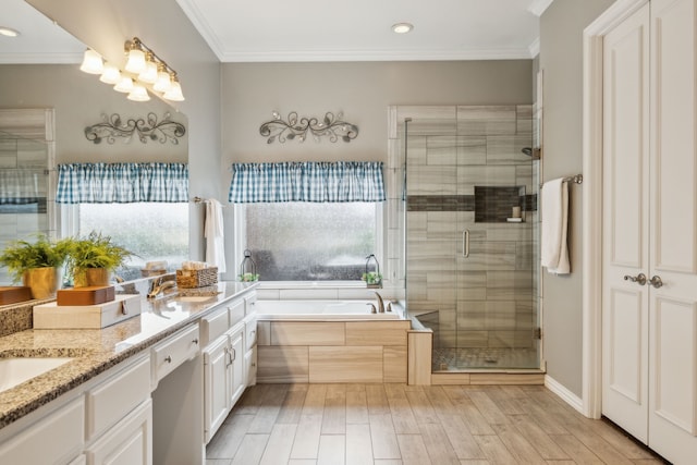 bathroom featuring plus walk in shower, crown molding, and vanity