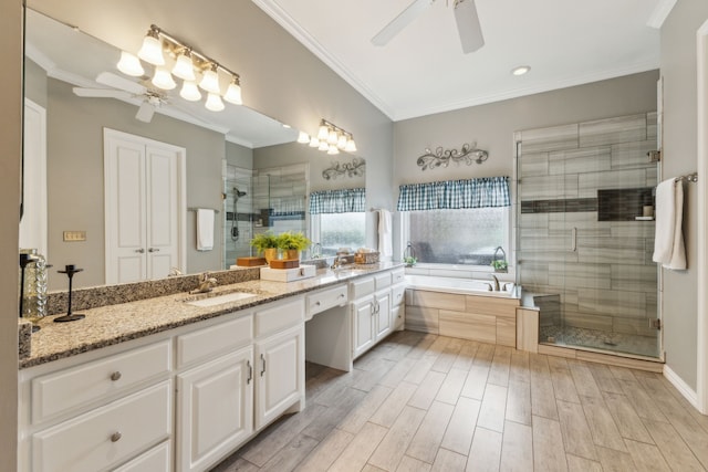 bathroom featuring ornamental molding, vanity, plus walk in shower, and ceiling fan