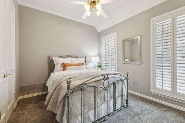 carpeted bedroom with lofted ceiling, ceiling fan, and ornamental molding