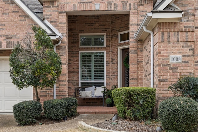 entrance to property featuring a garage