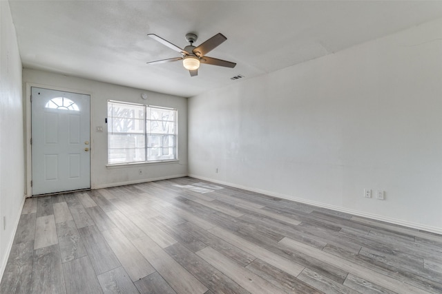 entrance foyer featuring ceiling fan and light wood-type flooring