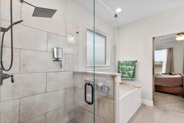 bathroom featuring ceiling fan and plus walk in shower