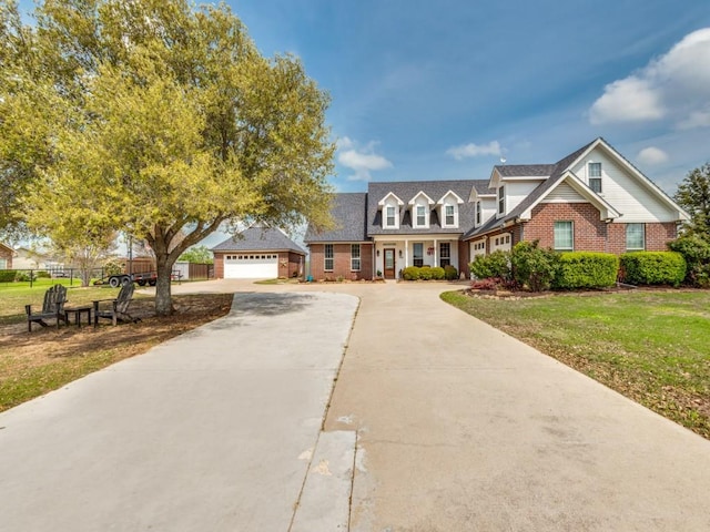 view of front of house featuring a garage and a front yard