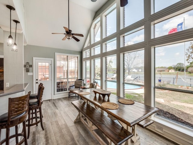 sunroom with vaulted ceiling and ceiling fan