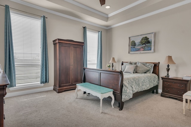 7728 County Road 1205, Rio Vista, TX 76093 - bedroom with light carpet, crown molding, a tray ceiling, baseboards, and a ceiling fan