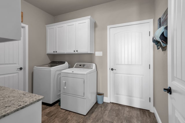 7728 County Road 1205, Rio Vista, TX 76093 - washroom with cabinet space, washer and dryer, dark wood-style floors, and baseboards