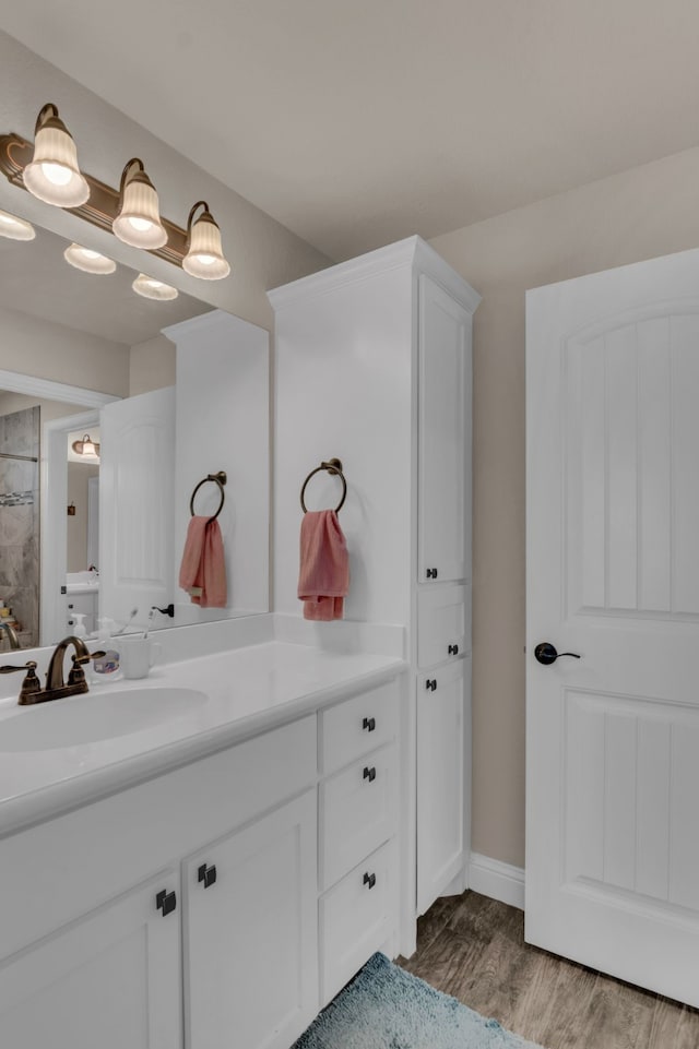 bathroom featuring vanity and hardwood / wood-style flooring