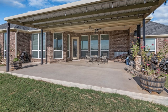 back of house featuring ceiling fan and a patio area