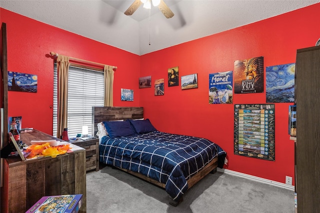 carpeted bedroom featuring vaulted ceiling and ceiling fan