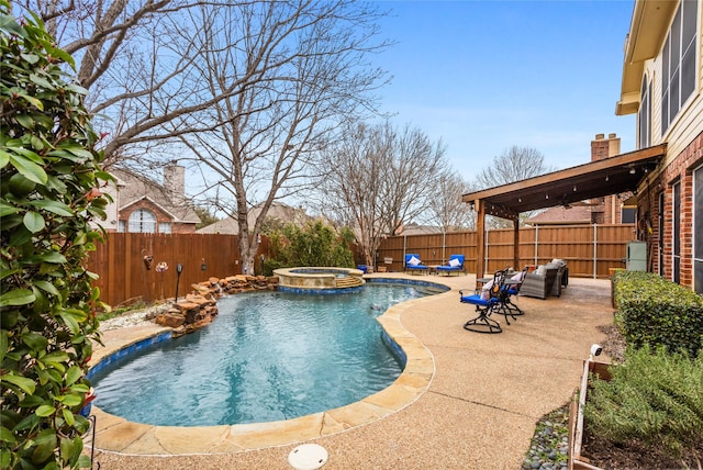 view of pool featuring an in ground hot tub and a patio area