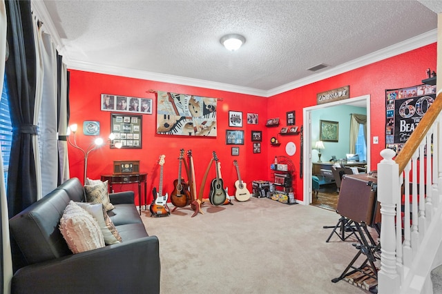 recreation room featuring ornamental molding, carpet flooring, and a textured ceiling