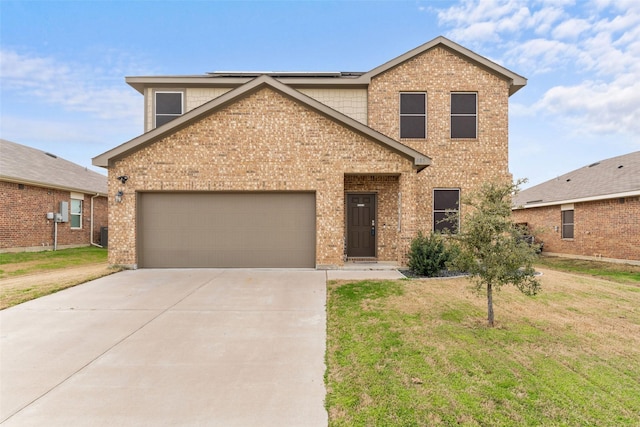 view of front of property with a garage and a front lawn