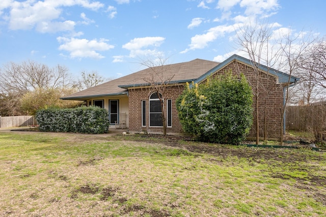 ranch-style house with a front yard