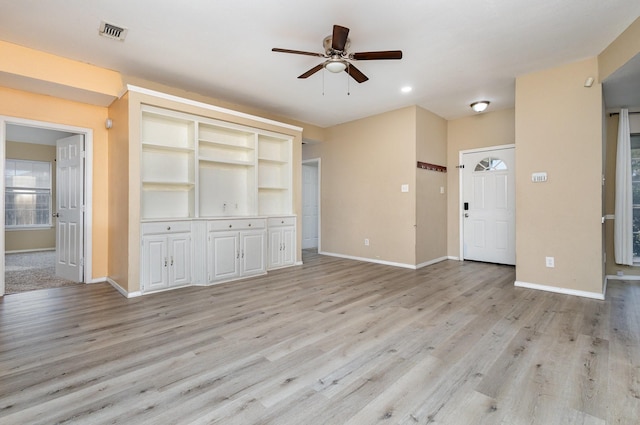 unfurnished living room with ceiling fan and light hardwood / wood-style flooring