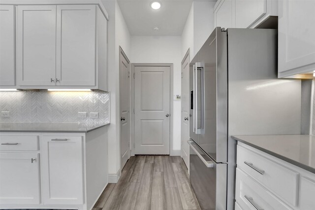 1004 Emil Pl, Allen, TX 75013 - kitchen with high end fridge, light wood-style flooring, white cabinets, decorative backsplash, and recessed lighting