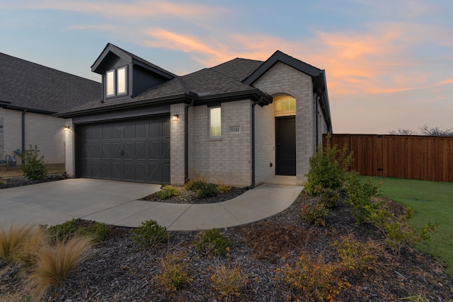 view of front of property with a garage