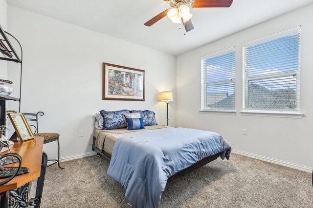 bedroom featuring ceiling fan and light carpet