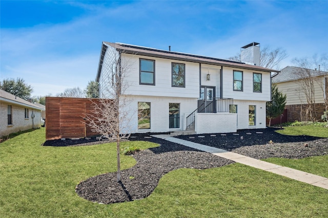 raised ranch featuring a front yard