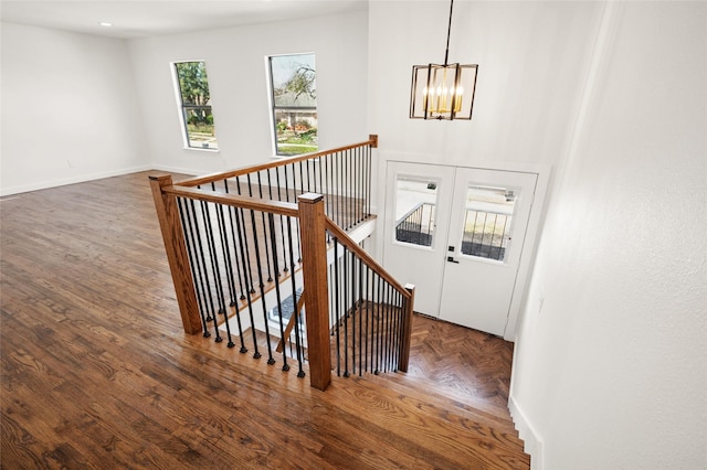 stairway with an inviting chandelier