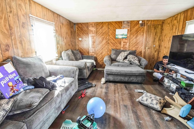 living room featuring hardwood / wood-style flooring and wood walls