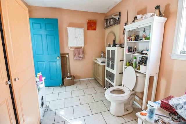 bathroom featuring tile patterned flooring and toilet