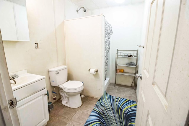 bathroom with a shower, toilet, and vanity