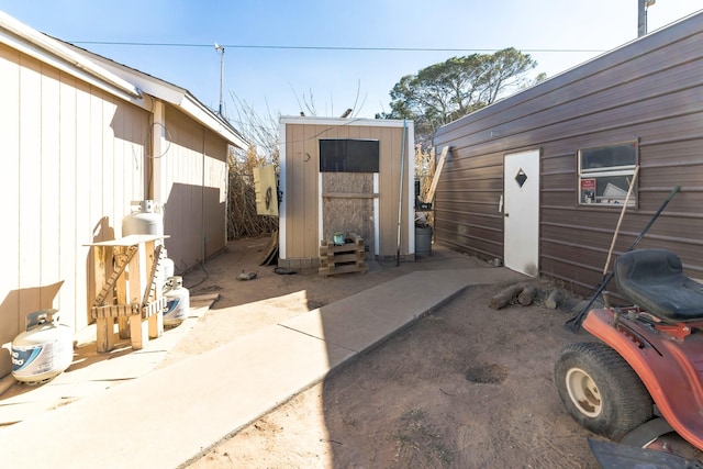 exterior space featuring a storage unit