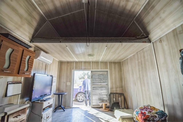 interior space with wooden walls, wood ceiling, and a wall unit AC