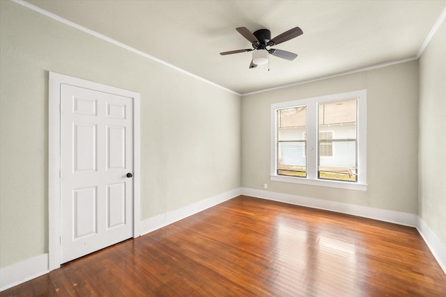 1402 W 1st Ave, Corsicana, TX 75110 - unfurnished room featuring baseboards, wood finished floors, a ceiling fan, and ornamental molding