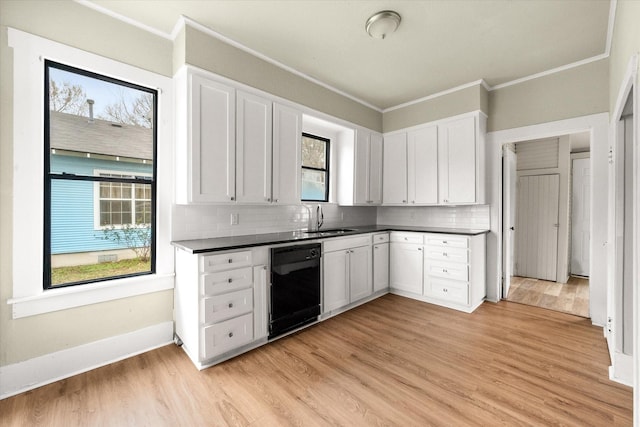 kitchen with white cabinetry, sink, ornamental molding, and black dishwasher