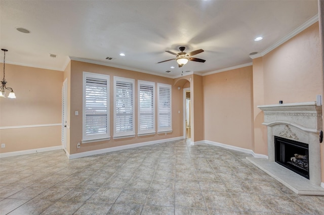 unfurnished living room featuring ornamental molding, a fireplace, and ceiling fan with notable chandelier