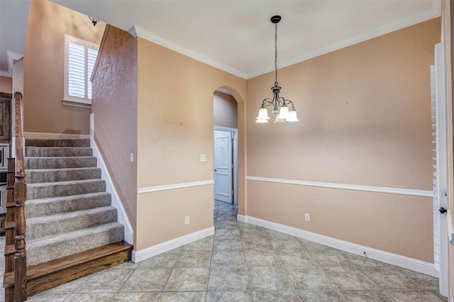 interior space featuring crown molding and a chandelier