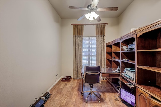 home office featuring ceiling fan and light hardwood / wood-style flooring