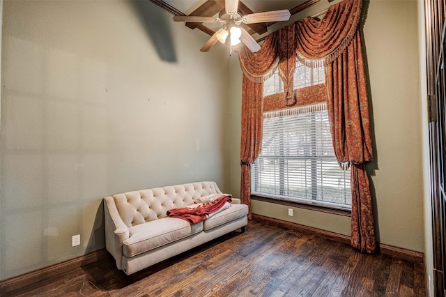 sitting room featuring dark hardwood / wood-style floors and ceiling fan