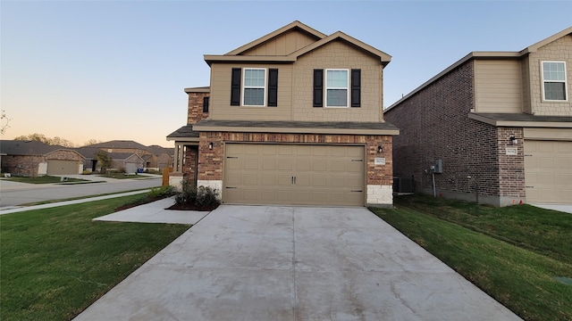 view of front of house with a garage, central AC unit, and a lawn