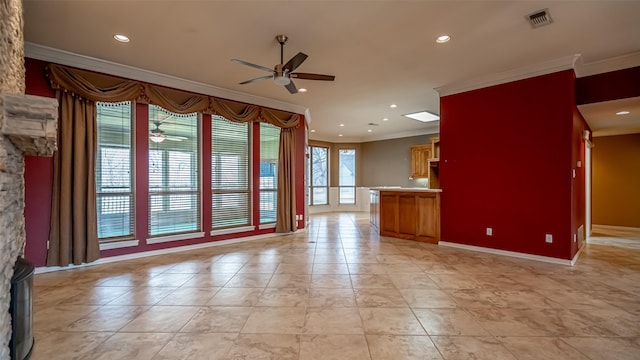 unfurnished room with crown molding, ceiling fan, and light tile patterned flooring