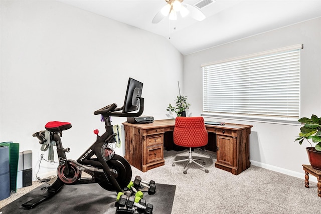 carpeted home office with ceiling fan and vaulted ceiling