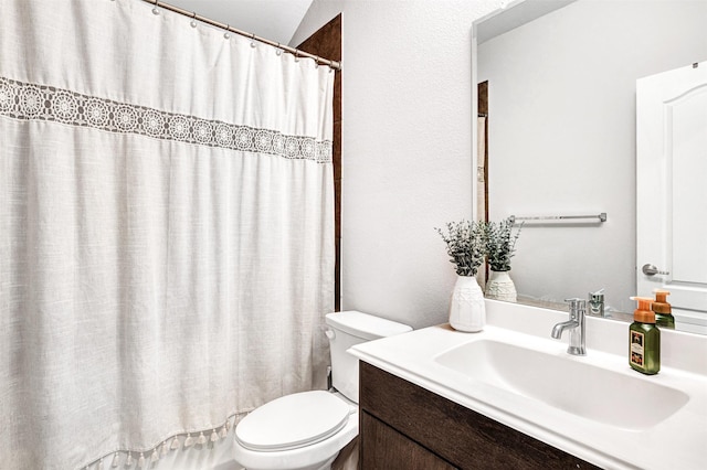 full bathroom featuring vanity, toilet, and shower / tub combo with curtain