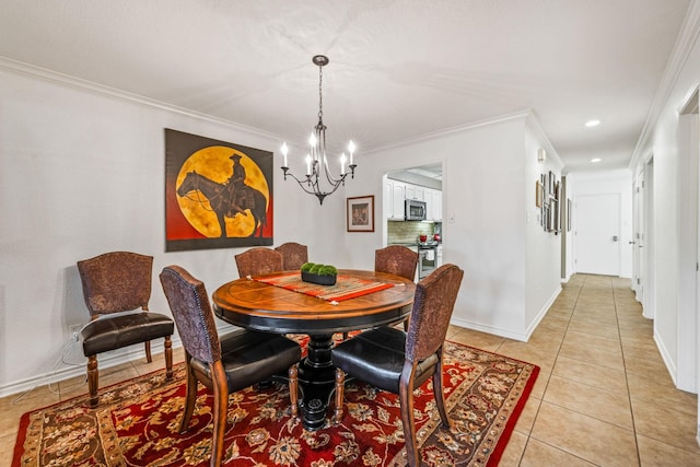 tiled dining room featuring crown molding and a chandelier