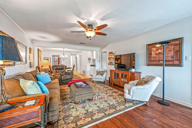 living room with crown molding, ceiling fan with notable chandelier, hardwood / wood-style floors, and a textured ceiling