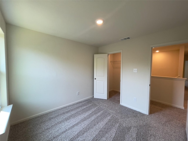231 Marsh Ln, Princeton, TX 75407 - unfurnished bedroom with carpet floors, a walk in closet, and a closet