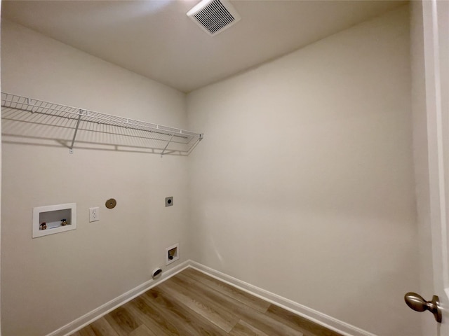 231 Marsh Ln, Princeton, TX 75407 - clothes washing area featuring washer hookup, hookup for a gas dryer, light hardwood / wood-style floors, and hookup for an electric dryer