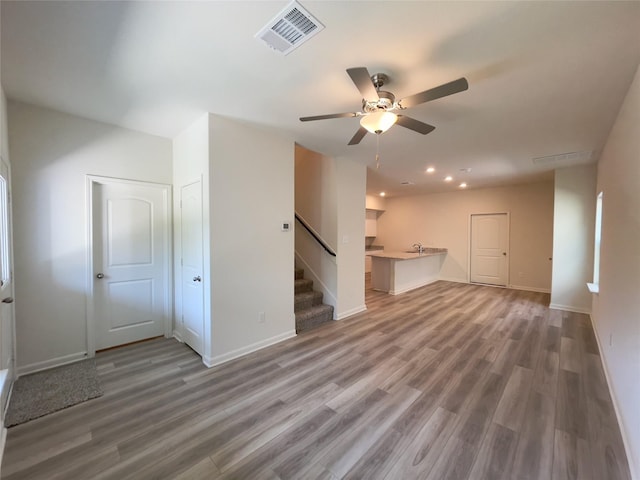 231 Marsh Ln, Princeton, TX 75407 - unfurnished living room featuring ceiling fan, sink, and hardwood / wood-style floors