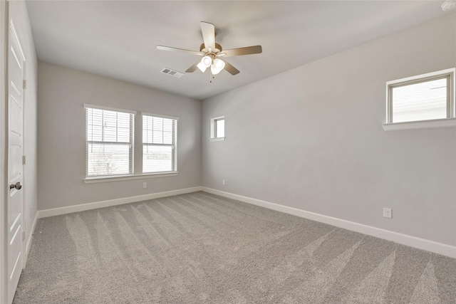 empty room with carpet and ceiling fan