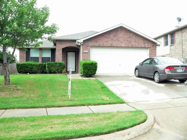 single story home featuring a garage and a front lawn