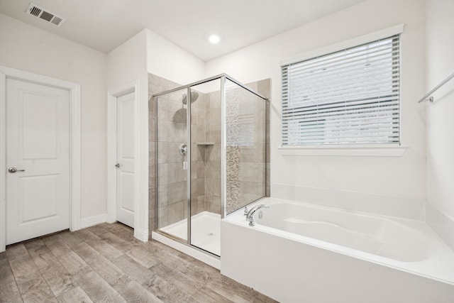 6201 Cheshire St, Celina, TX 76227 - bathroom featuring wood-type flooring and separate shower and tub
