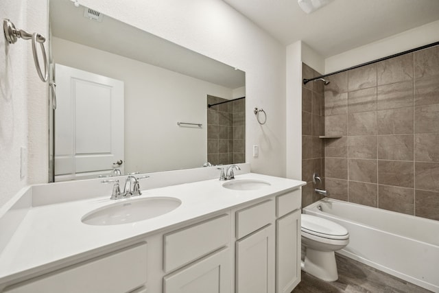 6201 Cheshire St, Celina, TX 76227 - full bathroom with vanity, tiled shower / bath combo, toilet, and hardwood / wood-style flooring